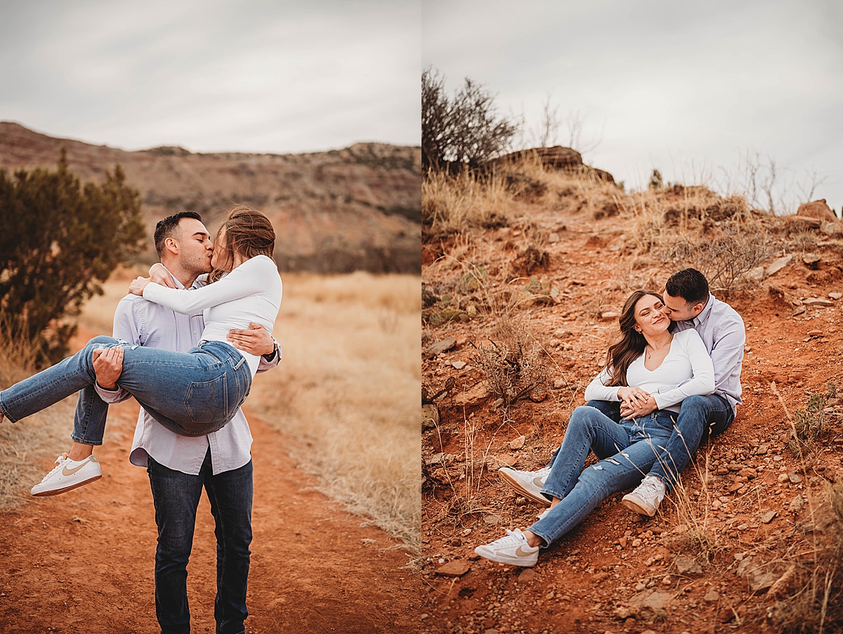 couple shares a kiss with red dirt background at sweet engagement shoot by Three Feather Photo Co