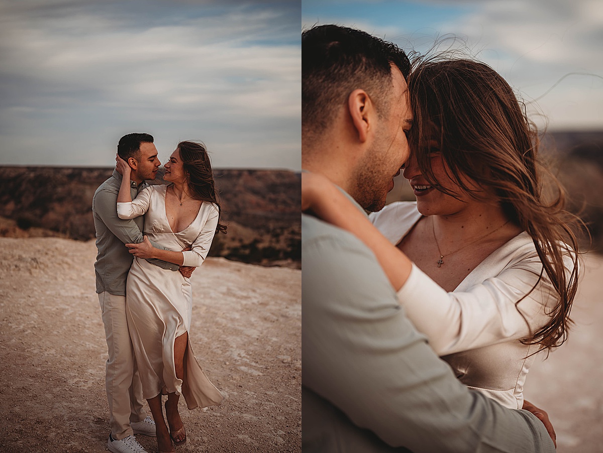 groom and bride-to-be in silk dress pose lovingly in front of dramatic natural background shot by Palo Duro Canyon Elopement Photographer