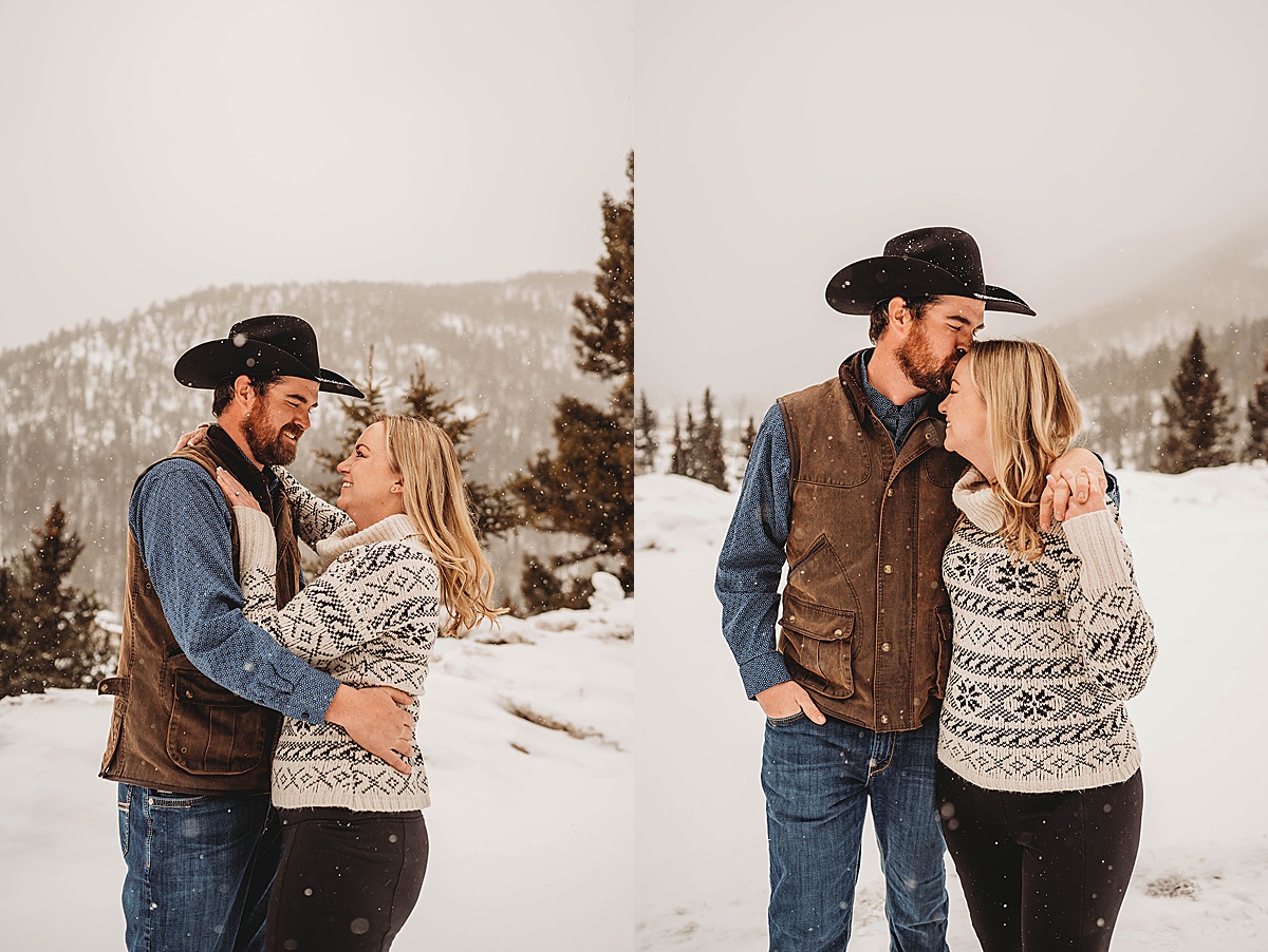 man in cowboy hat and woman in cozy sweater smile during engagement shoot by Three Feather Photo Co