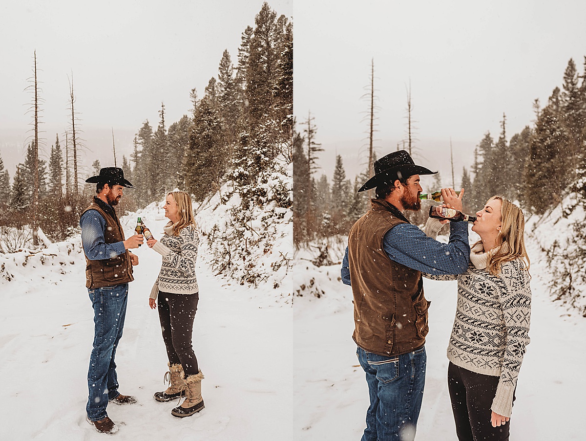 couple share a sip of their favorite beer during snowy engagement shoot by Palo Duro Canyon Elopement Photographer