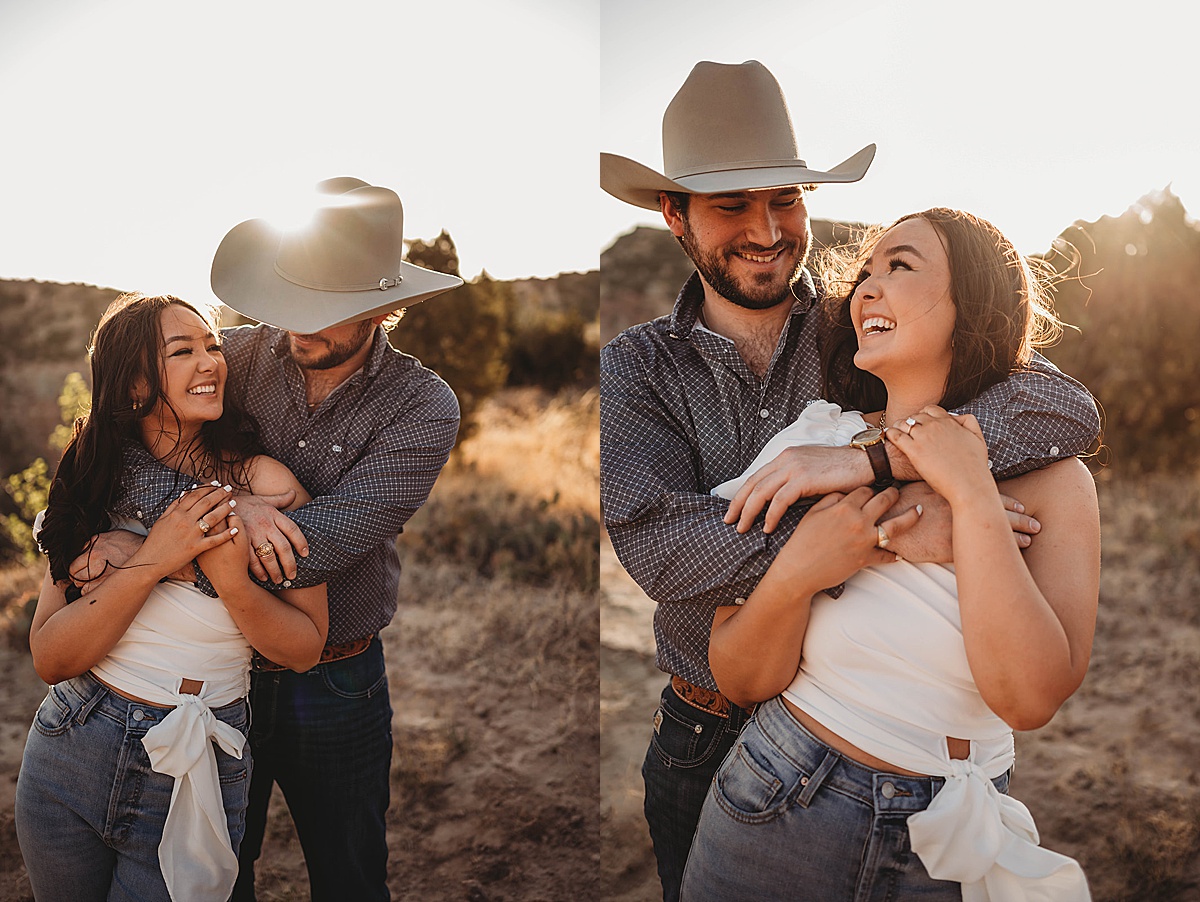 Young couple smile and hug during engagement shoot by Three Feather Photo Co