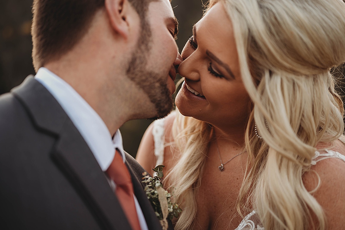 bride and groom kiss tenderly after boho wedding shot by palo duro canyon elopement photographer