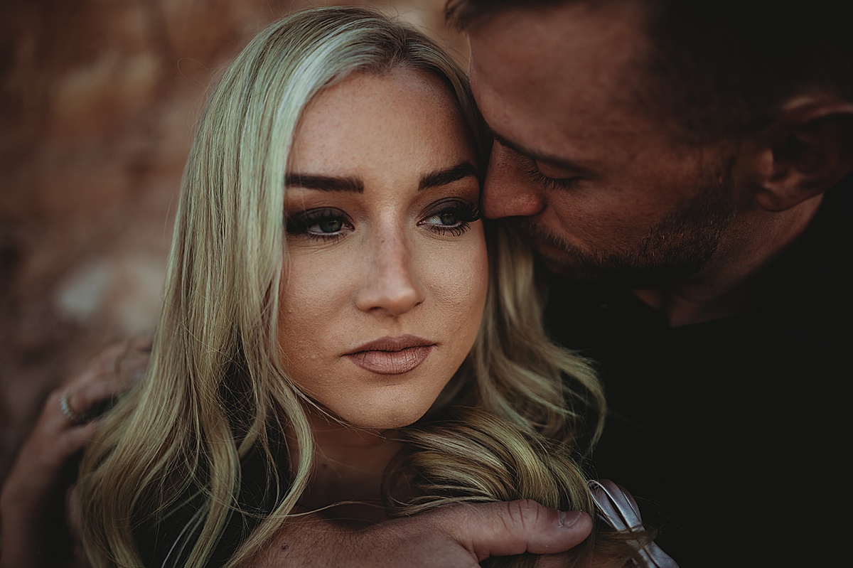 romantic couple embrace during quicksilver and moonlight engagement session