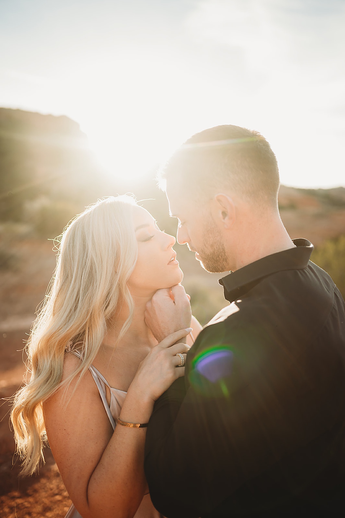elegant couple pose during golden hour for quicksilver and moonlight engagement session