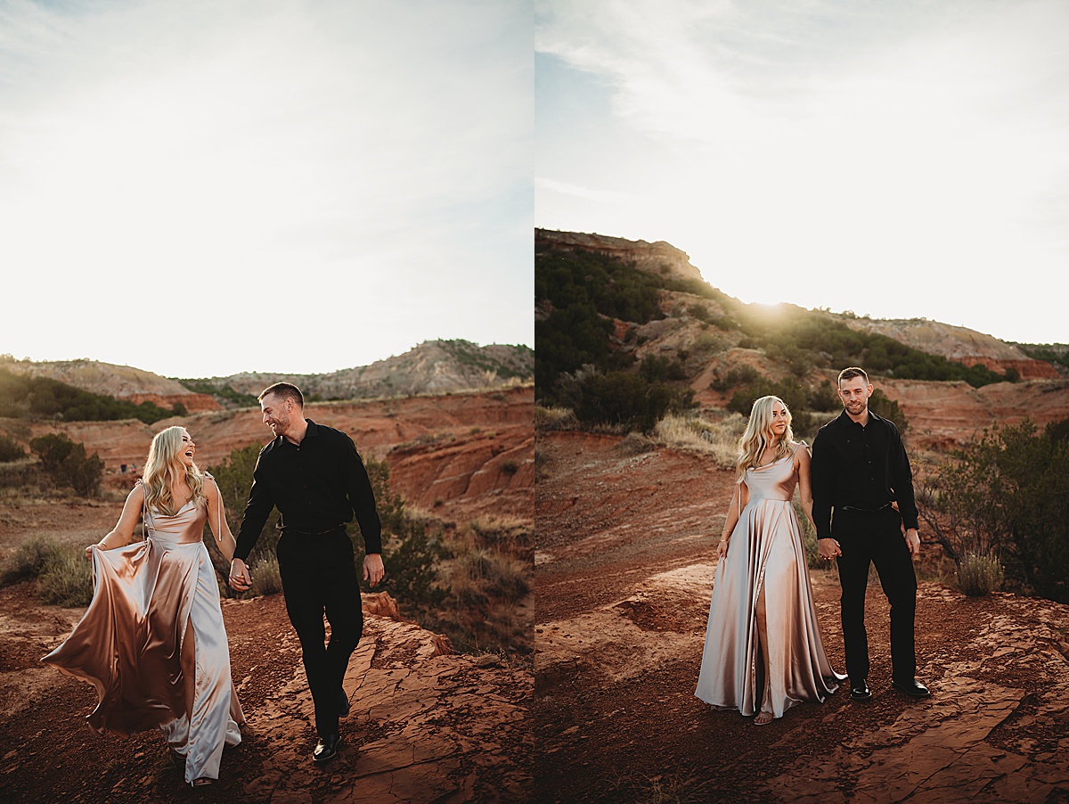 woman in satin evening gown and man in black suit pose in palo duro canyon during engagement shoot by Three Feather Photo Co.