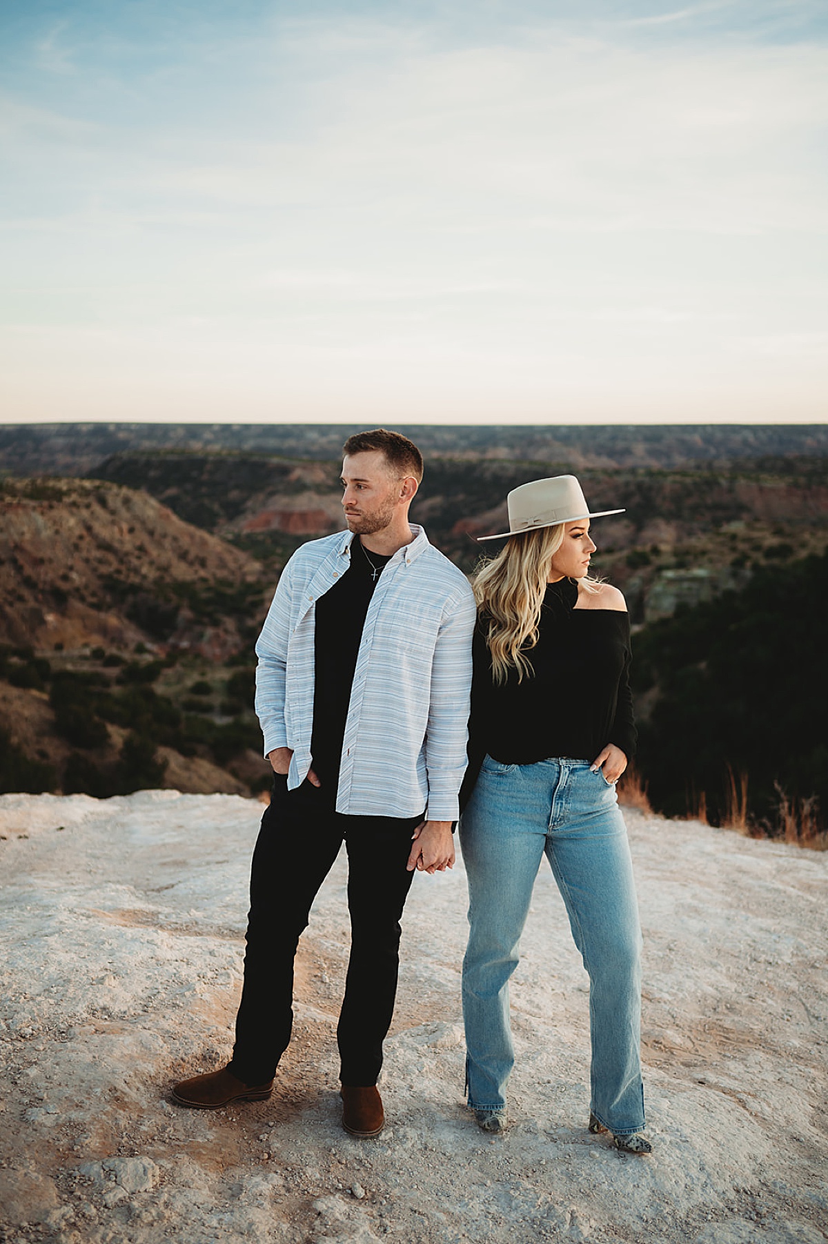 man and woman pose with romantic view behind them during shoot with Palo Duro Canyon elopement photographer