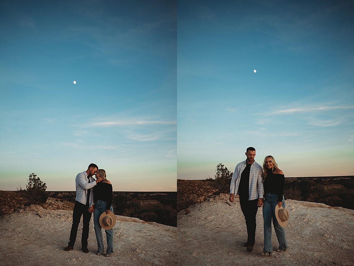 couple pose with moon above them during romantic engagement shoot by Palo Duro Canyon elopement photographer