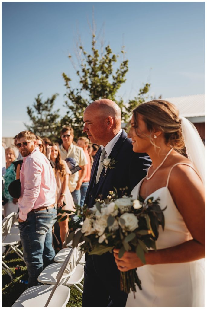 father walks bride down aisle by Palo Duro wedding photographer