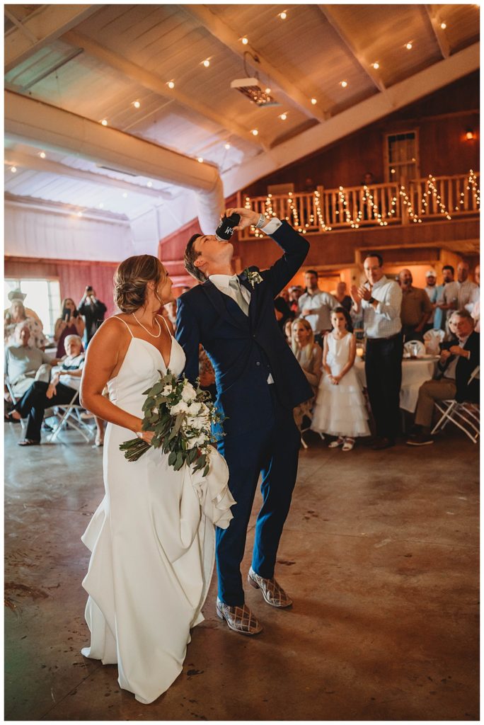 man and woman enter reception at Texas ranch wedding