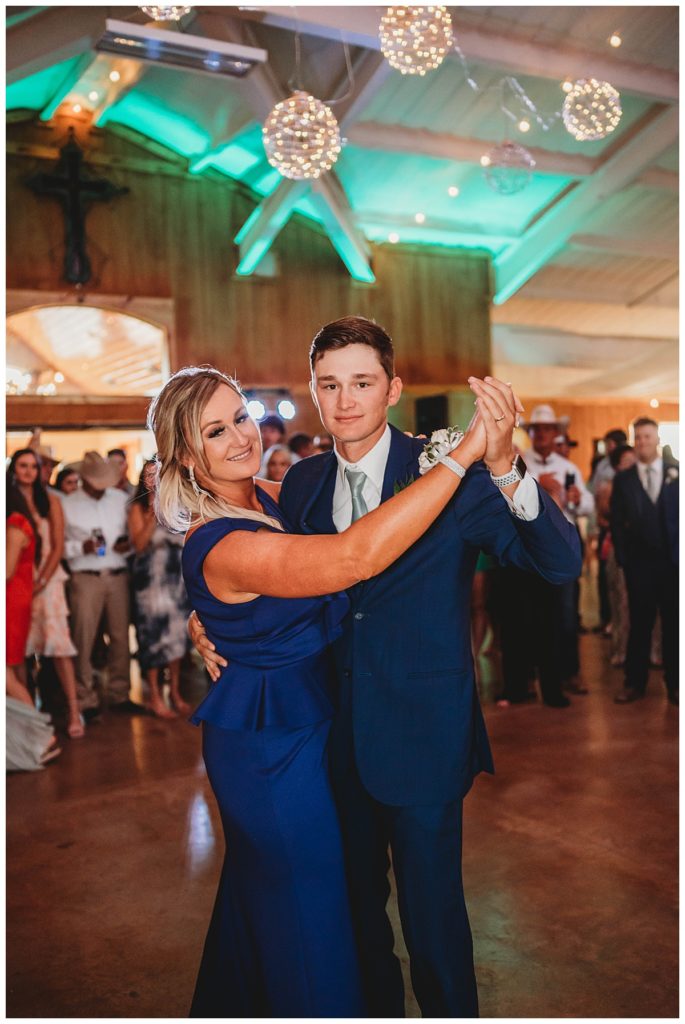 groom and mother dance at Texas ranch wedding