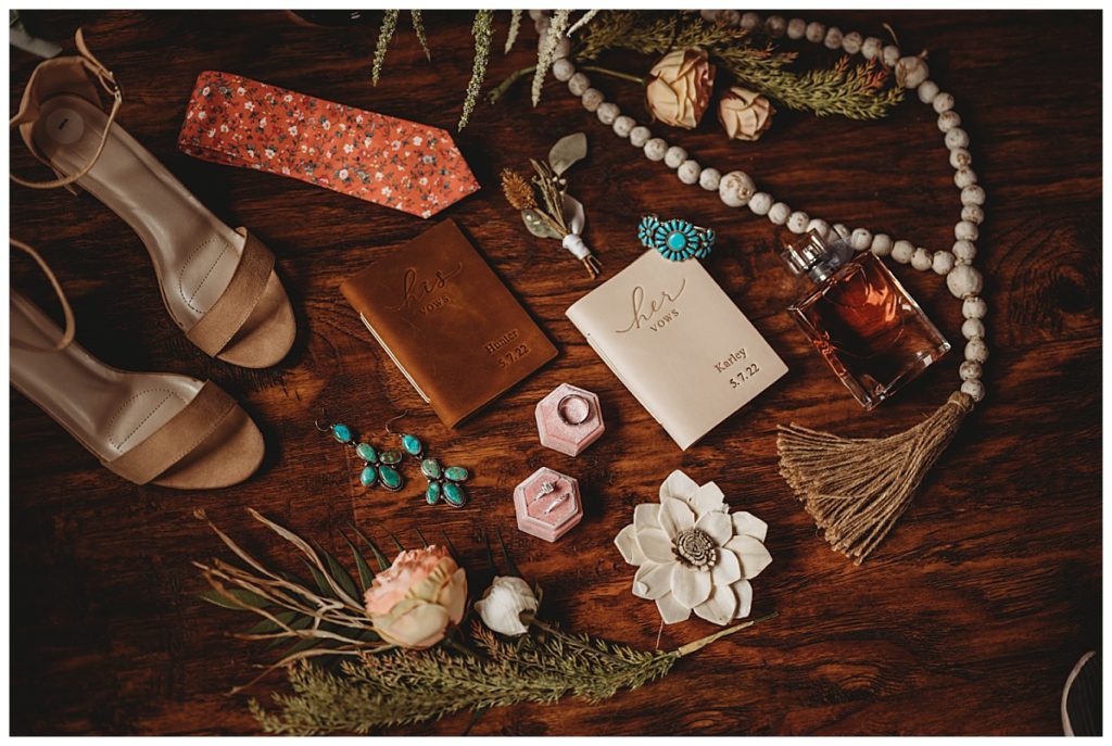 vow books, rings, shoes and rosary at Colorado cabin elopement