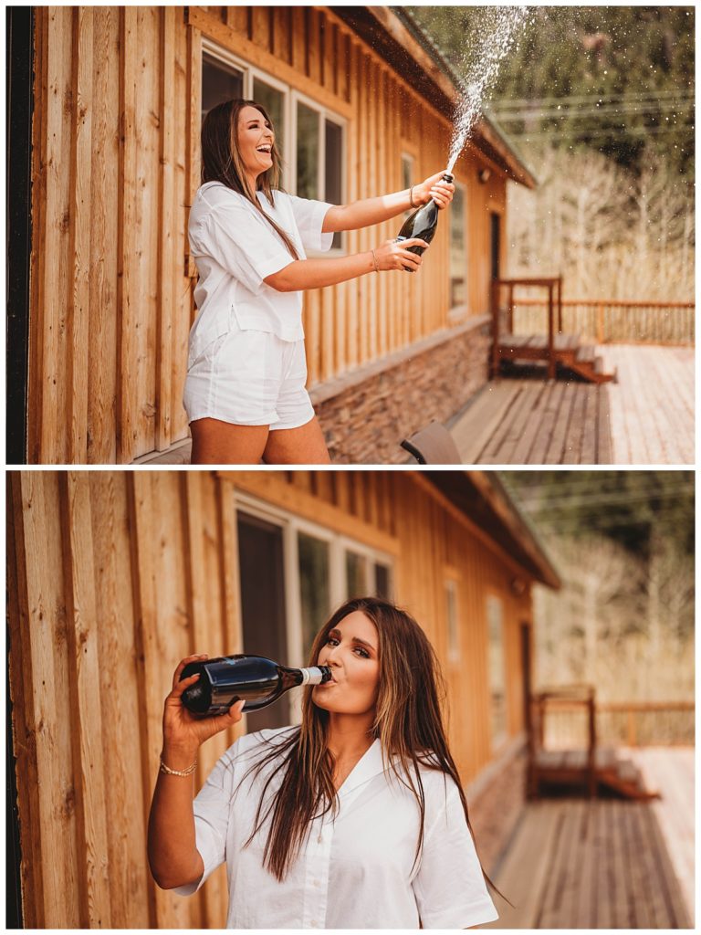 woman spraying and drinking champagne at Colorado cabin elopement