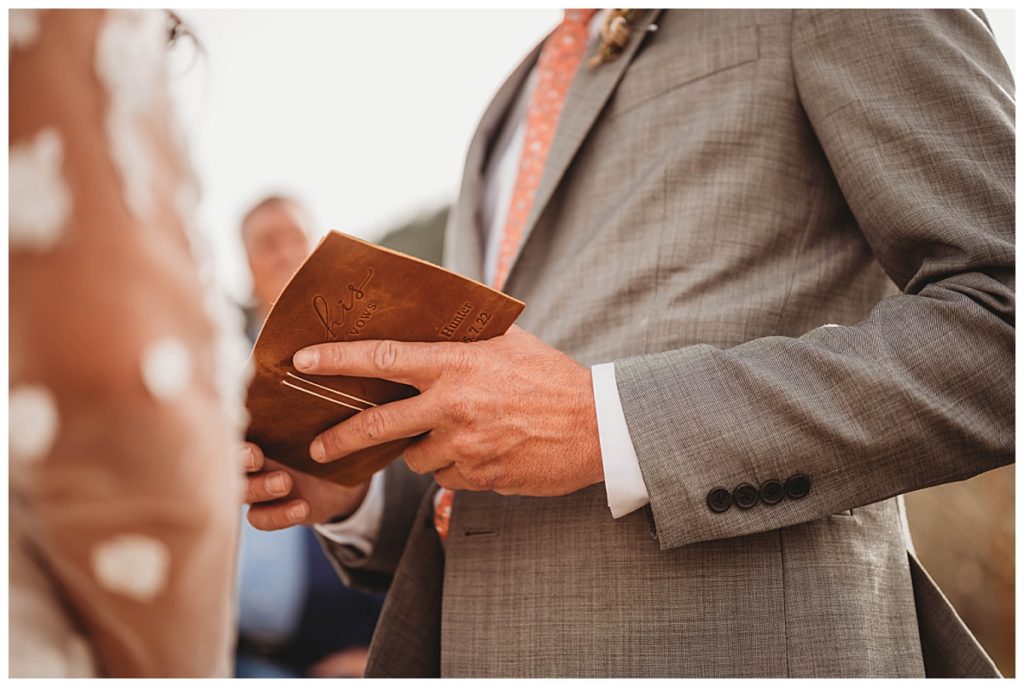 groom holding vows by Palo Duro wedding photographer