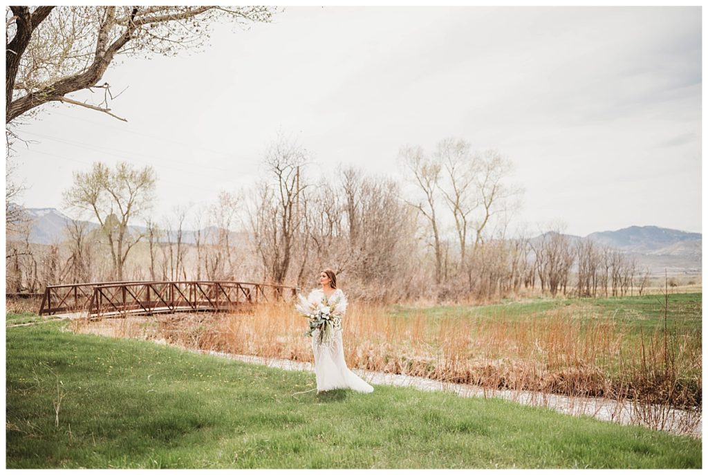 woman standing by creek by Palo Duro wedding photographer