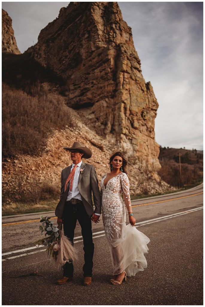 couple standing in road by Palo Duro wedding photographer