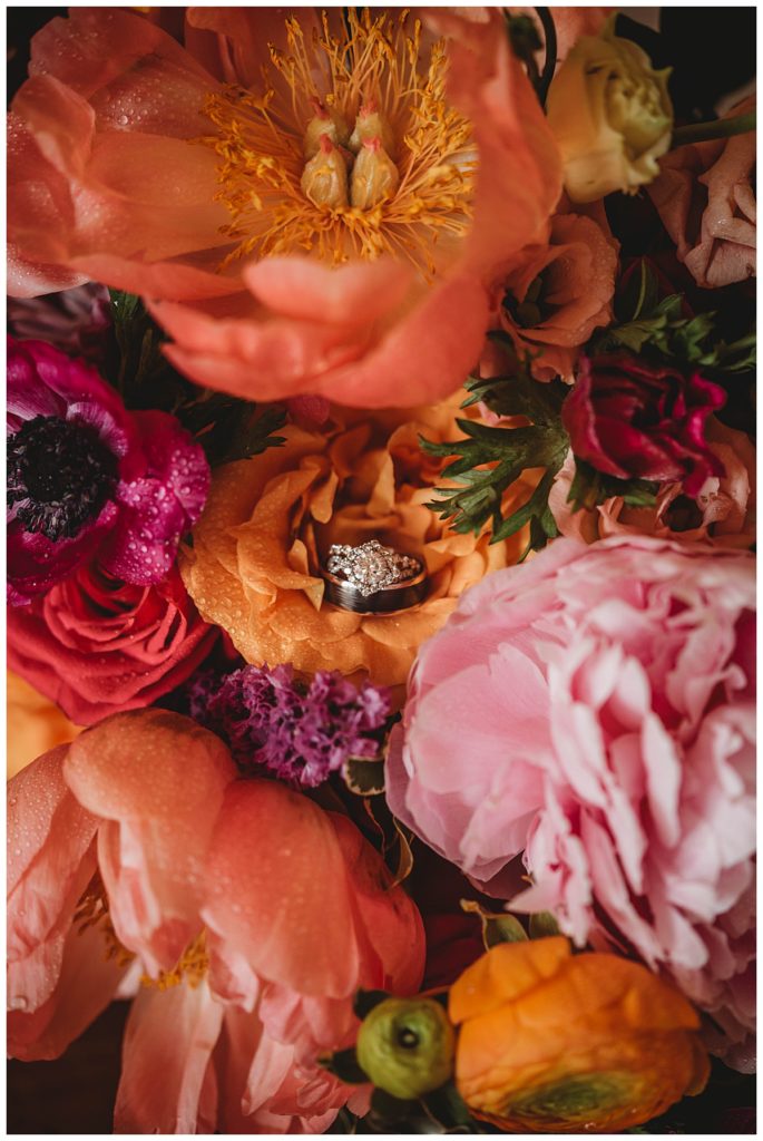 rings in floral bouquet at Austin villa wedding