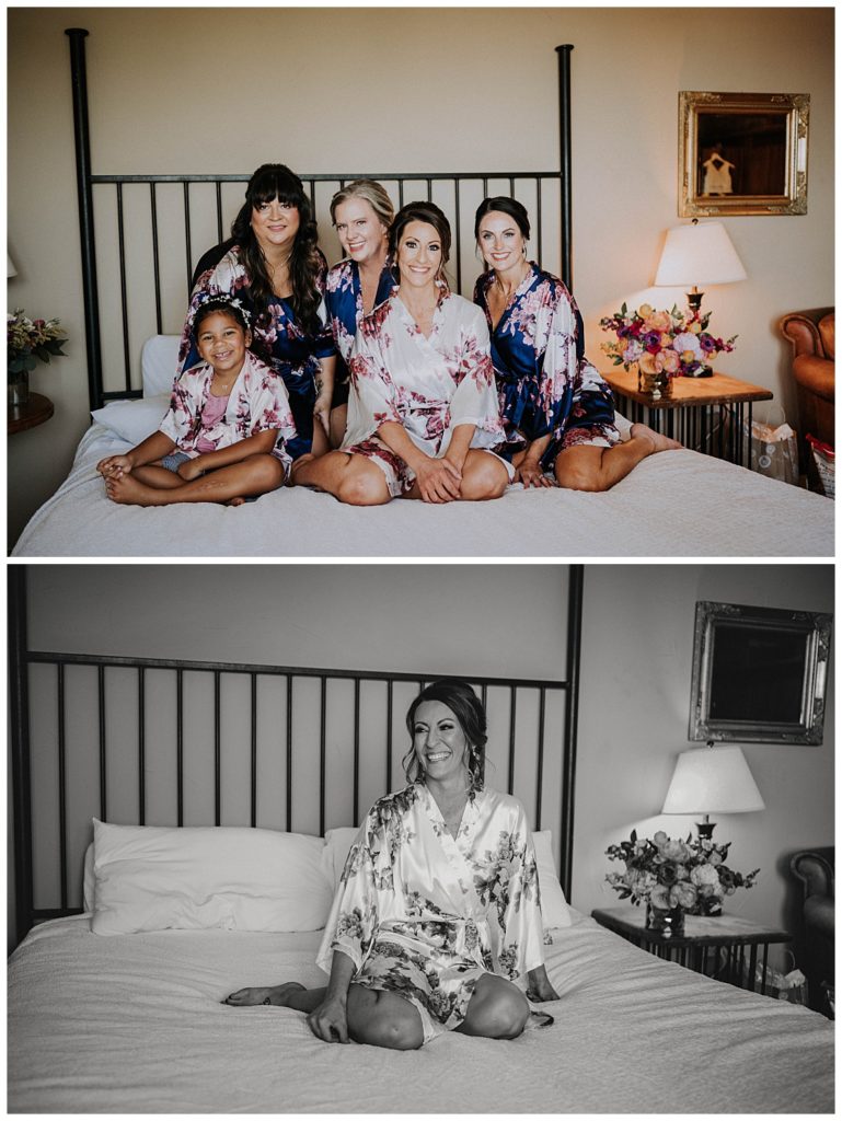 bridal party poses on bed at Austin villa wedding