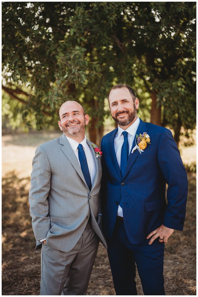 two men smile by Palo Duro wedding photographer