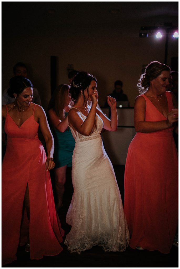 women dance at wedding reception Austin villa wedding