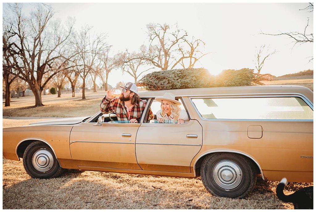 couple hangs out of car windows at family session in Amarillo