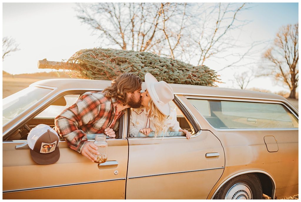 couple kisses through car windows by Palo Duro Wedding Photographer