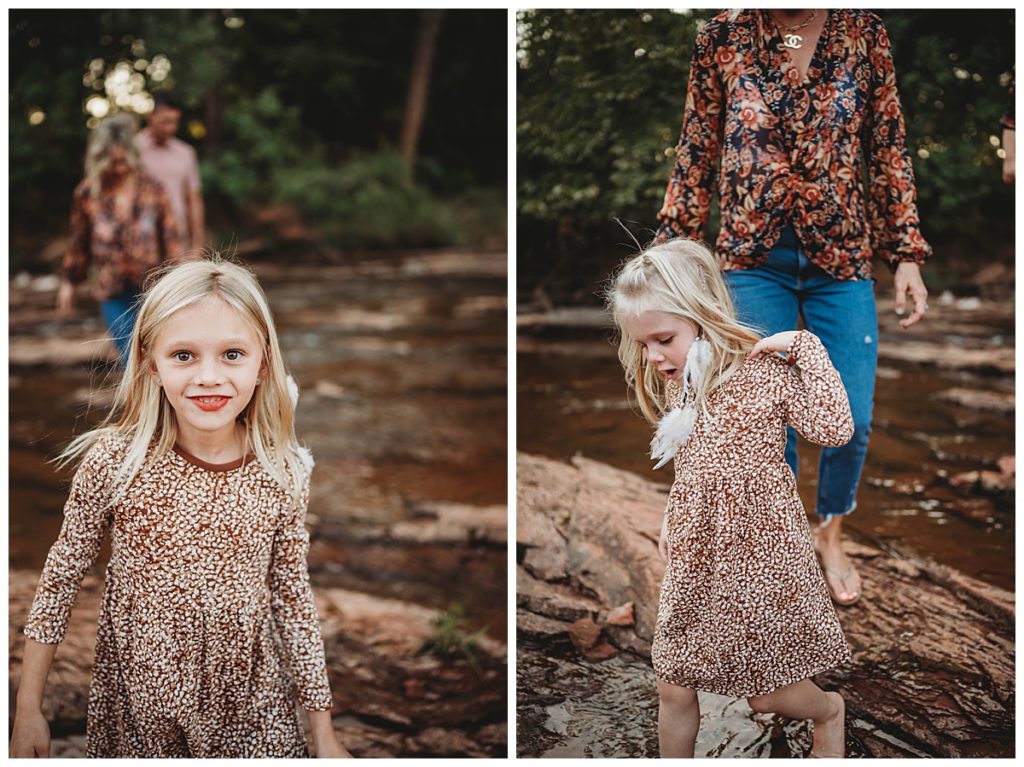 girls in matching dresses walk in creek by Three Feather Photo