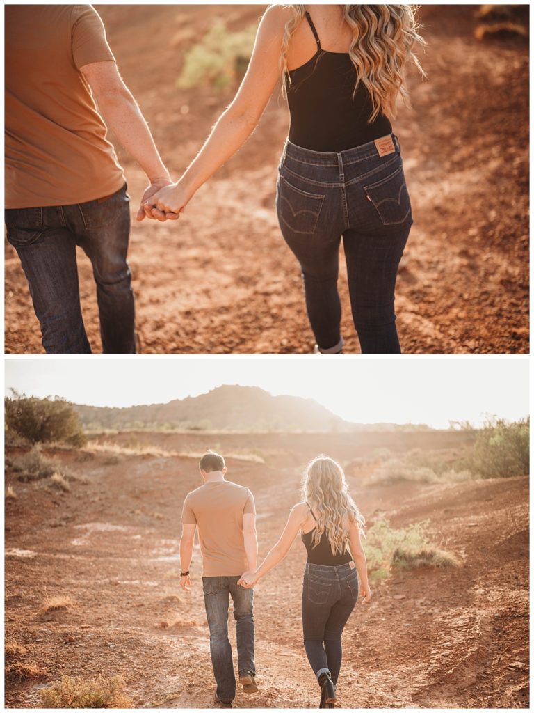 couple holds hands walking by Three Feather Co