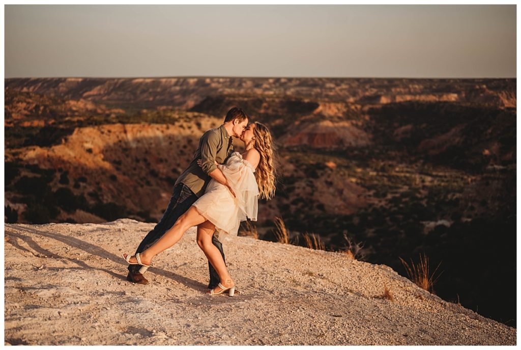man dips woman by canyon for Amarillo Portrait Photographer