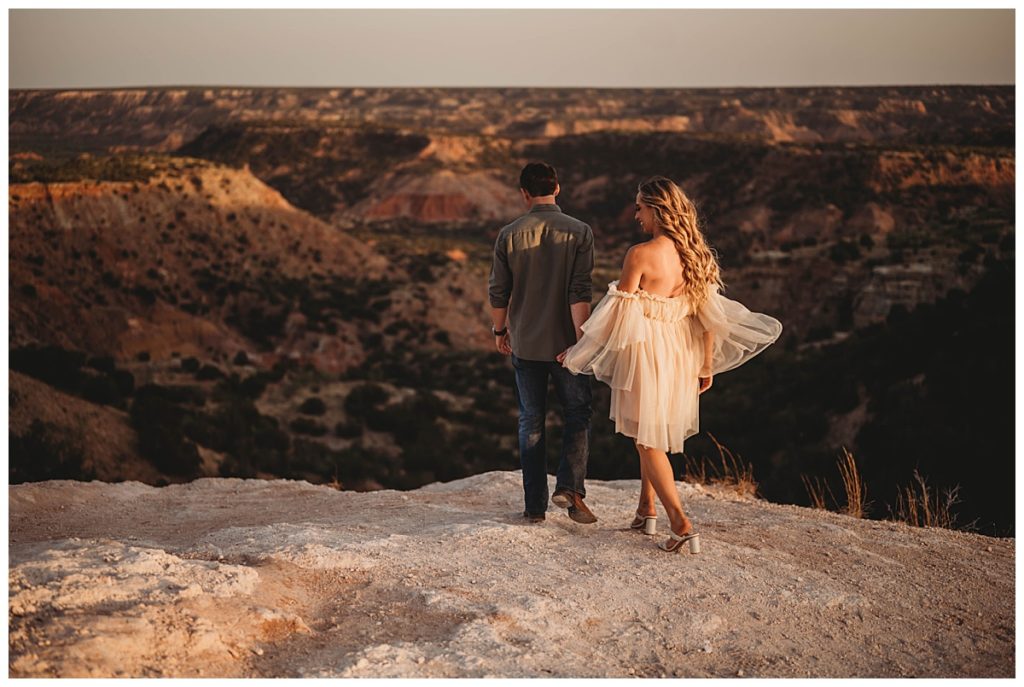 couple stands at scenic lookout by Amarillo Portrait Photographer