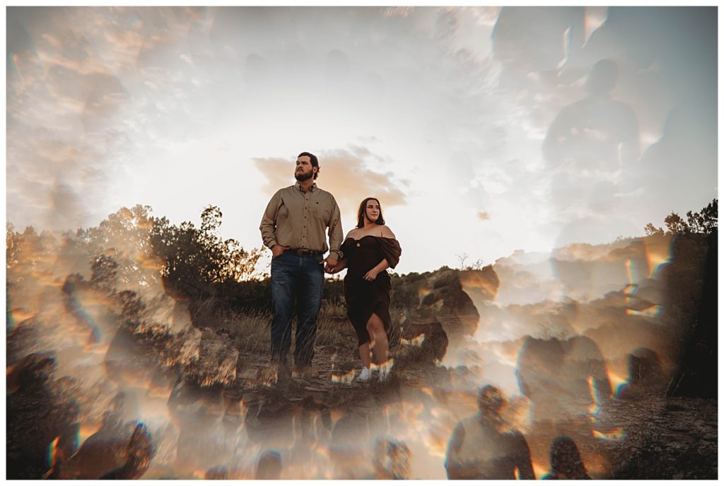 woman and man looking out over canyon by Three Feather Photo Co