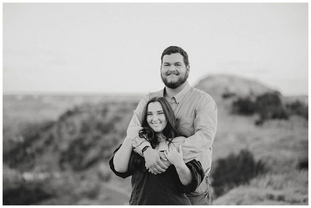 engaged couple in Palo Duro Canyon by Three Feather Photo Co