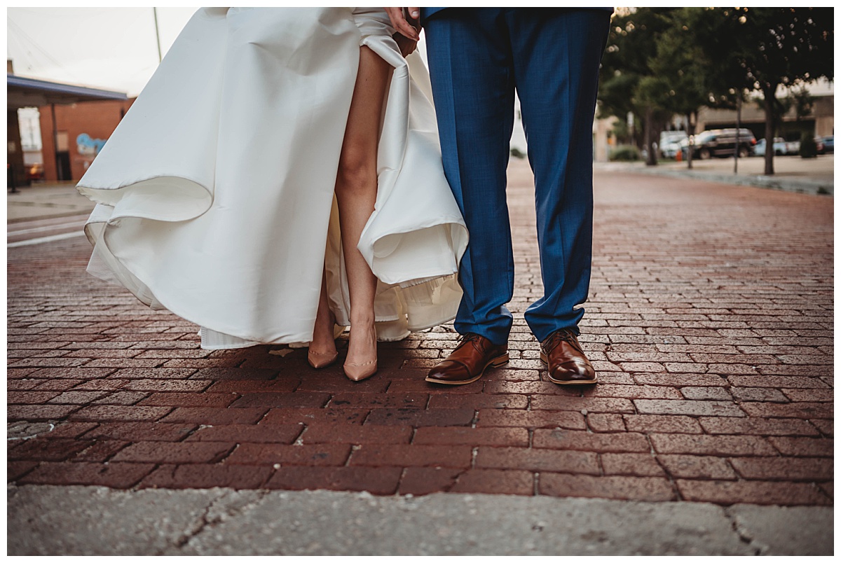 Legs of bride and groom by Three Feather Photography